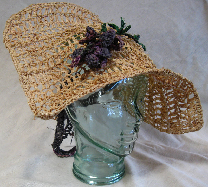 Shepherdess Hat with Wisteria, crocheted raffia by C. Buffalo Larkin